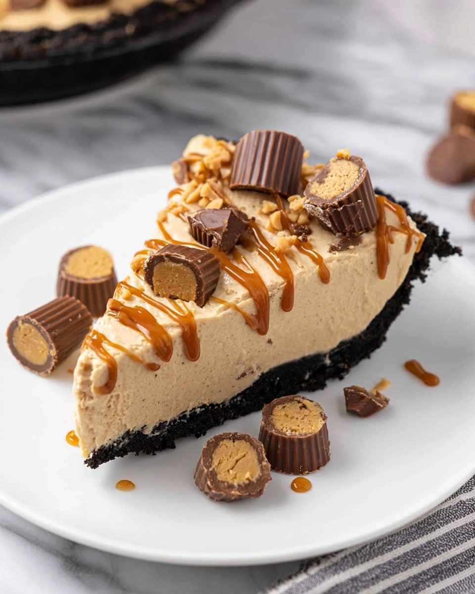 A slice of creamy peanut butter cheesecake sits on a white plate over a white marbled surface. The cheesecake has two main layers: a thick black cookie crust at the bottom with a crumbly texture, and a smooth, light peanut butter filling on top. The filling is beige with a soft and fluffy texture. Drizzled on the top is a thin layer of golden caramel or peanut butter sauce in a crisscross pattern. The cheesecake slice is topped with broken mini chocolate peanut butter cups scattered unevenly, showcasing a dark chocolate outside and a peanut butter interior. Around the plate are a few whole mini chocolate peanut butter cups placed randomly. Photo taken with an iphone --ar 4:5 --v 7