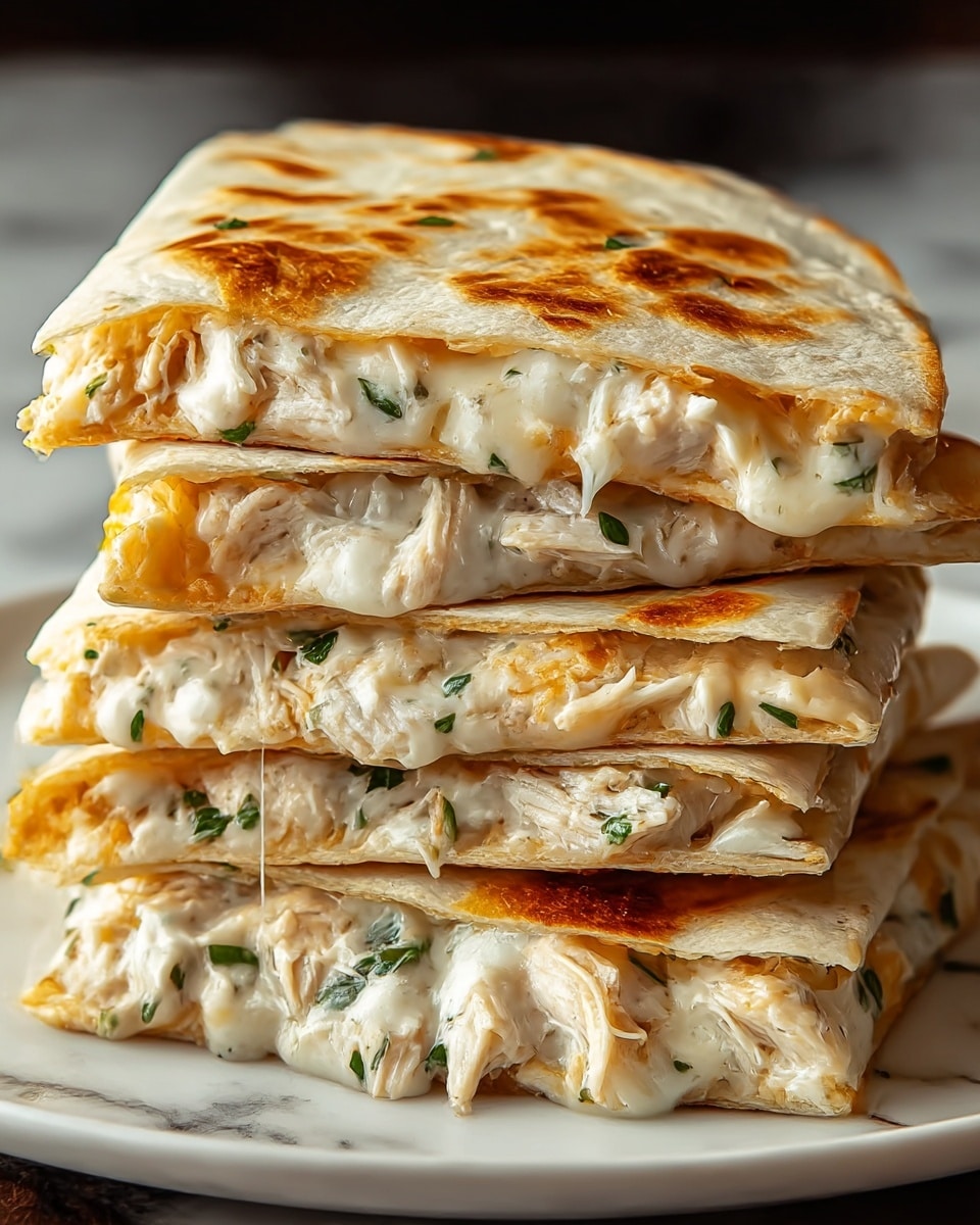 A stack of four folded quesadilla quarters is shown close up, each quarter with a toasted, golden-brown tortilla layer on the outside, slightly crispy with darker brown spots. Inside each quarter is a creamy, cheesy filling mixed with shredded white chicken and small chopped green herbs scattered throughout. The layers appear soft and gooey, with cheese stretching slightly between the folds. The stack sits on a dark round plate placed on a surface with a white marbled texture. Photo taken with an iphone --ar 4:5 --v 7